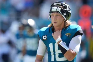 Jacksonville Jaguars quarterback Trevor Lawrence (16) takes a break during the second half of an NFL football game against the Miami Dolphins, Sunday, Sept. 8, 2024, in Miami Gardens, Fla. (AP Photo/Wilfredo Lee)