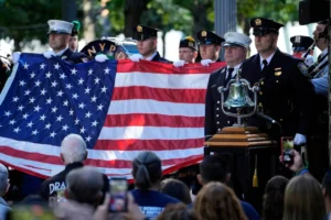 A New York Police Department honor guard holds an American flag during a 9/11 commemoration ceremony at Ground Zero, in New York, Wednesday, Sept. 11, 2024. (AP Photo/Jacquelyn Martin) Ground zero 9/11 anniversary