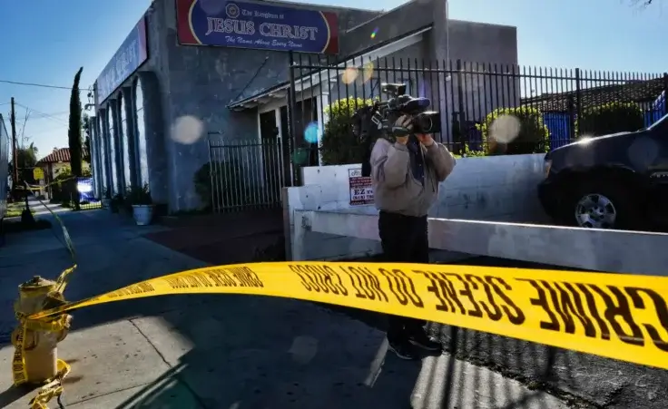 In this Wednesday, Jan. 29, 2020, file photo, crime scene tape is seen closing off an area around the grounds of the Kingdom of Jesus Christ Church in the Van Nuys section of Los Angeles. Apollo Quiboloy and officials with the Philippines-based church have been charged as part of an alleged scheme to trick followers into becoming fundraisers and arrange sham marriages to keep them in the U.S. (AP Photo/Richard Vogel, File)
