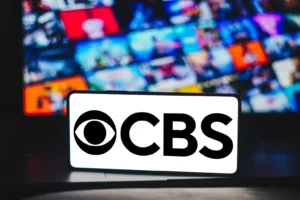 In this photo illustration, the Columbia Broadcasting System (CBS) logo is displayed on a smartphone screen. By RafaelHenrique/stock.adobe.com.