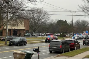 Emergency vehicles are parked outside the Abundant Life Christian School in Madison, Wis., where multiple injuries were reported following a shooting, Monday, Dec. 16, 2024. (AP Photo/Scott Bauer)