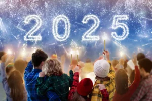 Family watching 2025 fireworks with sparklers. By famveldman/stock.adobe.com. New Year's traditions