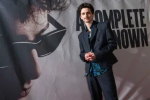Timothee Chalamet poses for photographers upon arrival at the premiere of the film 'A Complete Unknown' in London, on Tuesday, Jan. 14, 2025. (Photo by Scott A Garfitt/Invision/AP)