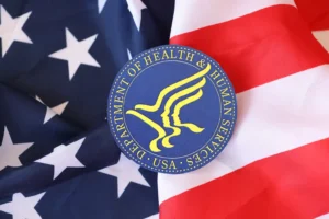 US Department of health and human services seal on the United States of America flag. By mehaniq41/stock.adobe.com. Robert F. Kennedy Jr.