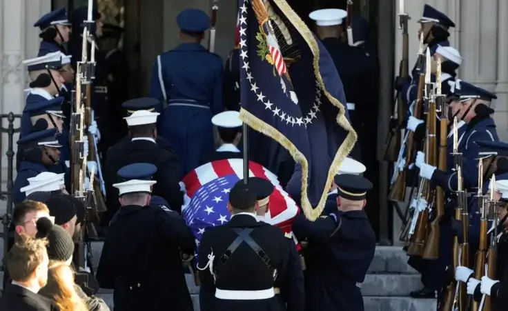 The flag-draped casket of former President Jimmy Carter arrives at Washington National Cathedral in Washington, Thursday, Jan. 9, 2025, for a State Funeral. (AP Photo/Mark Schiefelbein)