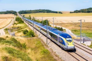 A Eurostar e320 high speed train is driving from Paris to London on the LGV Nord, the North European high speed railway line, in the french countryside. By olrat/stock.adobe.com