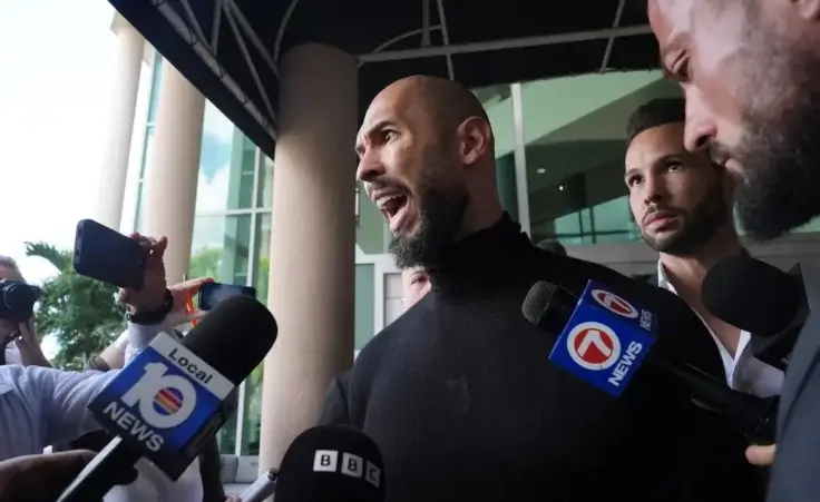 Influencer brothers Andrew and Tristan Tate arrive, Thursday, Feb. 27, 2025, in Fort Lauderdale, Fla. The brothers were charged with human trafficking in Romania and arrived in the U.S. after authorities lifted travel restrictions. (AP Photo/Marta Lavandier)