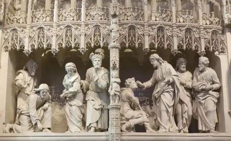 Notre Dame catholic cathedral, Chartres, France. Ambulatory sculptures. Jesus and the woman caught in adultery, by Jean Dedieu, 1678-1679, and Jesus healing a blind man, by Pierre I Legros, 1681-1683. by Julian/stock.adobe.com