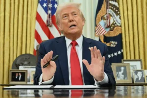 President Donald Trump speaks to reporters before signing an executive order in the Oval Office of the White House in Washington, Monday, March 31, 2025. (Pool via AP) Third term