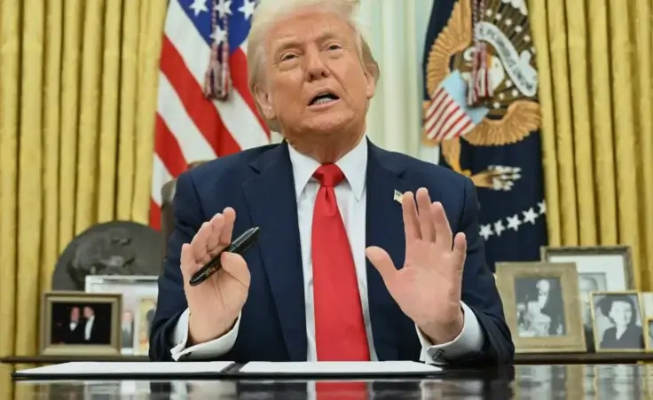 President Donald Trump speaks to reporters before signing an executive order in the Oval Office of the White House in Washington, Monday, March 31, 2025. (Pool via AP) Third term