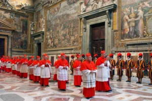 In this photo from files taken on April 18, 2005 and released by the Vatican paper L'Osservatore Romano, Cardinals walk in procession to the Sistine Chapel at the Vatican, at the beginning of the conclave. (Osservatore Romano via AP, File) Who will be the next pope
