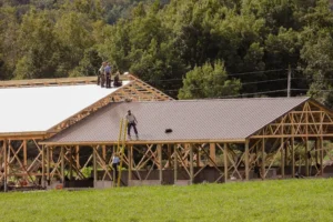 Amish workers building a structure. By Robert/stock.adobe.com. Hurricane Helene relief