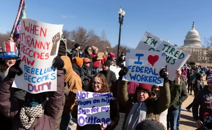 People take part in the "No Kings Day" protest on Presidents Day in Washington, in support of federal workers and against recent actions by President Donald Trump and Elon Musk, Monday, Feb. 17, 2025, by the Capitol in Washington. The protest was organized by the 50501 Movement, which stands for 50 Protests 50 States 1 Movement. (AP Photo/Jose Luis Magana) May Day Protests