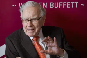In this May 5, 2019, file photo Warren Buffett, Chairman and CEO of Berkshire Hathaway, speaks during a game of bridge following the annual Berkshire Hathaway shareholders meeting in Omaha, Nebraska. (AP Photo/Nati Harnik)