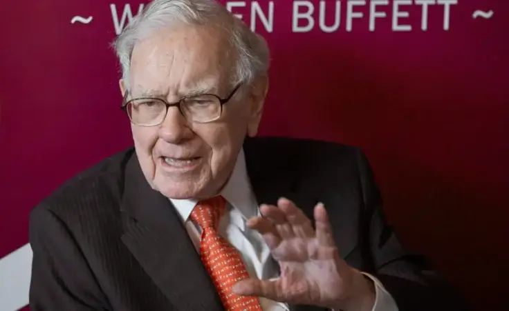 In this May 5, 2019, file photo Warren Buffett, Chairman and CEO of Berkshire Hathaway, speaks during a game of bridge following the annual Berkshire Hathaway shareholders meeting in Omaha, Nebraska. (AP Photo/Nati Harnik)