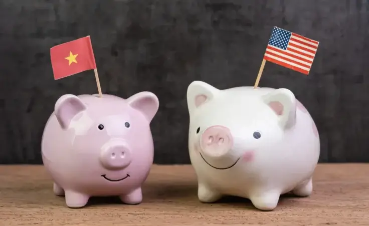 US and China tariff negotiations represented by piggy banks with national flags. By Nuthawut/stock.adobe.com.
