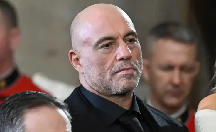 Joe Rogan stands for a benediction after President Donald Trump was sworn in during the 60th Presidential Inauguration in the Rotunda of the U.S. Capitol in Washington, Jan. 20, 2025. (Saul Loeb/Pool photo via AP, File)