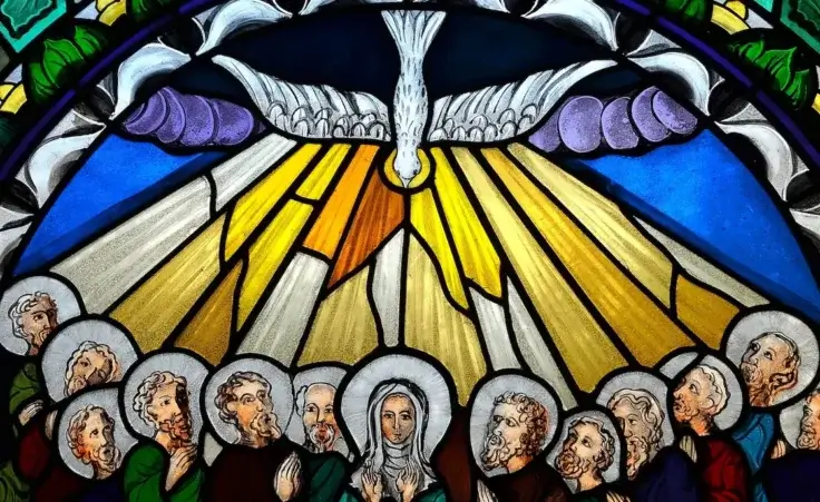 Stained glass window depicting Pentecost. By Pio Si/stock.adobe.com