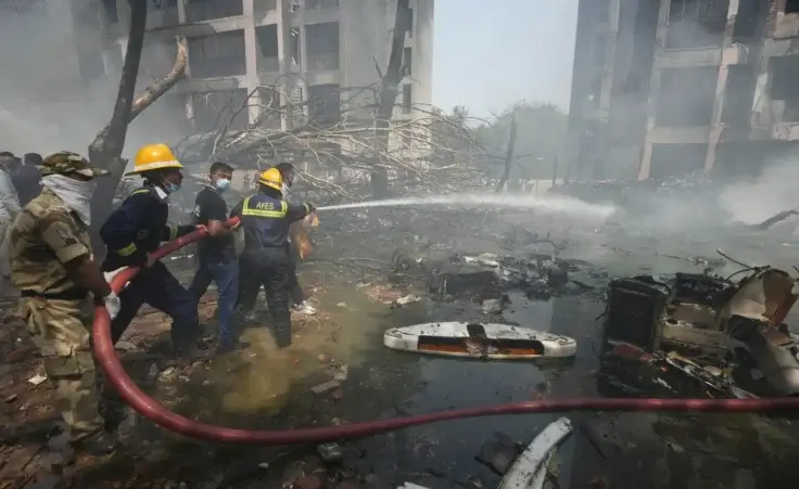 Firefighters work at the site of an airplane that crashed in India's northwestern city of Ahmedabad in Gujarat state, India, Thursday, June 12, 2025. (AP Photo/Ajit Solanki)