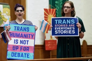 Transgender rights supporters rally at the Lutheran Church of the Reformation on Capitol Hill, Wednesday, June 18, 2025, in Washington, after the Supreme Court upheld Tennessee's ban on gender-affirming care for transgender minors, in a setback to transgender rights. (AP Photo/Mariam Zuhaib)