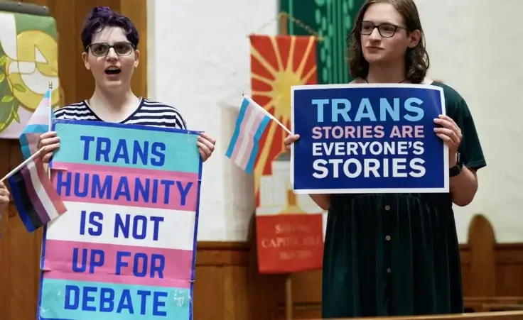 Transgender rights supporters rally at the Lutheran Church of the Reformation on Capitol Hill, Wednesday, June 18, 2025, in Washington, after the Supreme Court upheld Tennessee's ban on gender-affirming care for transgender minors, in a setback to transgender rights. (AP Photo/Mariam Zuhaib)
