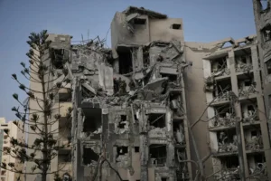 Israeli soldiers and rescue team search for survivors amid the rubble of residential buildings destroyed by an Iranian missile strike that killed several people, in Beersheba, Israel, on Tuesday, June 24, 2025. (AP Photo/Leo Correa) ceasefire