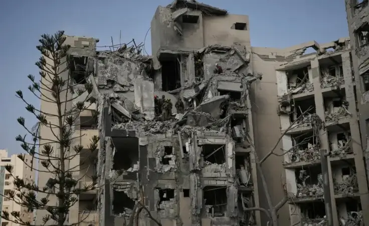 Israeli soldiers and rescue team search for survivors amid the rubble of residential buildings destroyed by an Iranian missile strike that killed several people, in Beersheba, Israel, on Tuesday, June 24, 2025. (AP Photo/Leo Correa) ceasefire