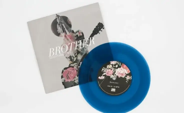 Brother is a song by American Christian rock band Needtobreathe. The song is a single from Rivers in the Wasteland album. Blue vinyl record, partial album cover. Taken in Miami, FL on July 15, 2022. By Blue/stock.adobe.com