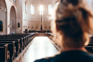 Woman in church heading to altar By Thomas Vitali/stock.adobe.com