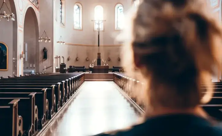 Woman in church heading to altar By Thomas Vitali/stock.adobe.com