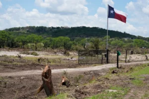 A property is cleared between Hunt and Ingram, Texas after a flood on Wednesday, July 9, 2025. (AP Photo/Ashley Landis)
