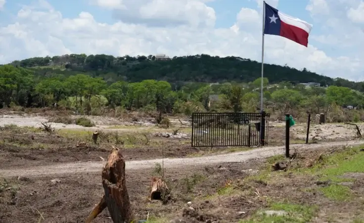 A property is cleared between Hunt and Ingram, Texas after a flood on Wednesday, July 9, 2025. (AP Photo/Ashley Landis)