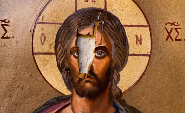 Vandalized art in an Orthodox church in Syria. By Goran/stock.adobe.com. Christianity