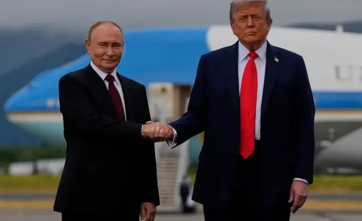President Donald Trump greets Russia's President Vladimir Putin Friday, Aug. 15, 2025, at Joint Base Elmendorf-Richardson, Alaska. (AP Photo/Julia Demaree Nikhinson)