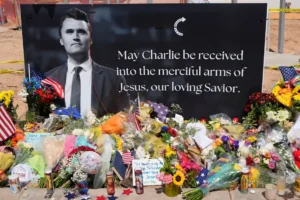 A makeshift memorial is set up at Turning Point USA headquarters after the shooting death at a Utah college on Wednesday, of Charlie Kirk, the co-founder and CEO of the organization, Thursday, Sept. 11, 2025, in Phoenix. (AP Photo/Ross D. Franklin)