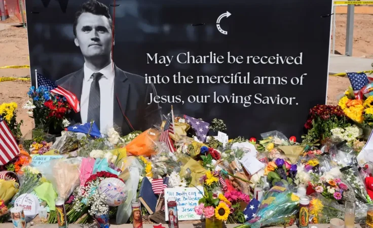 A makeshift memorial is set up at Turning Point USA headquarters after the shooting death at a Utah college on Wednesday, of Charlie Kirk, the co-founder and CEO of the organization, Thursday, Sept. 11, 2025, in Phoenix. (AP Photo/Ross D. Franklin)