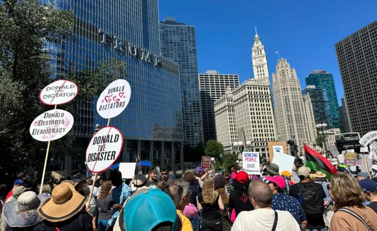 Protesters gather for a Labor Day rally in view of Trump Tower in Chicago, Monday, Sept. 1, 2025. (AP Photo/Melina Walling) trump