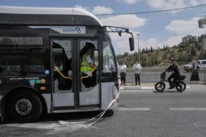 Israeli police and rescue teams inspect the scene of a shooting attack carried out by two Palestinian gunmen, in which several people were killed and others injured at a bus stop in Jerusalem, Monday, Sept. 8, 2025. (AP Photo/Mahmoud Illean)