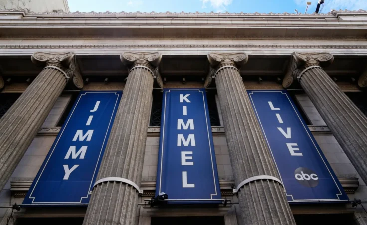 Banners are placed outside the El Capitan Entertainment Centre, where Jimmy Kimmel Live! is filmed, on Thursday, Sept. 18, 2025, in Los Angeles. (AP Photo/Damian Dovarganes)