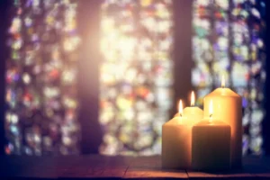 Candles in a church background. By BrianJackson/stock.adobe.com Michigan