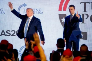 President Donald Trump is joined on stage with Turning Point USA Founder Charlie Kirk as he finishes speaking at Turning Point USA Teen Student Action Summit at the Marriott Marquis in Washington, Tuesday, July 23, 2019. (AP Photo/Andrew Harnik)