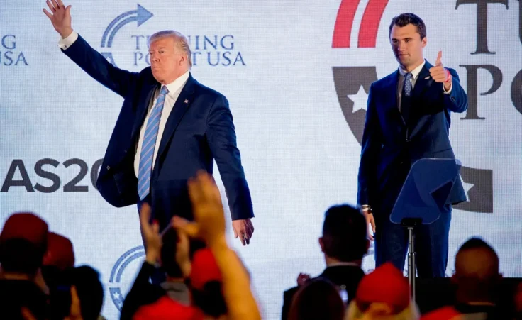 President Donald Trump is joined on stage with Turning Point USA Founder Charlie Kirk as he finishes speaking at Turning Point USA Teen Student Action Summit at the Marriott Marquis in Washington, Tuesday, July 23, 2019. (AP Photo/Andrew Harnik)