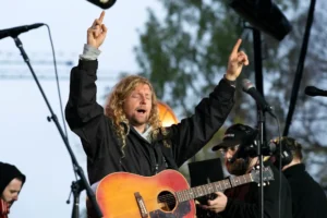 Christian musician Sean Feucht of California sings to the crowd during a rally at the National Mall in Washington, Sunday, Oct. 25, 2020. (AP Photo/Jose Luis Magana)