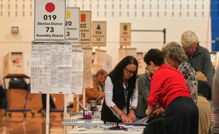 Workers prepare for voters at a poll site, in New York, Tuesday, Nov. 4, 2025. (AP Photo/Richard Drew) What do today’s elections mean for our national future?