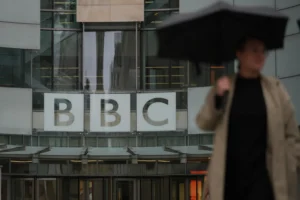 A man walks outside the BBC Headquarters in London, Monday, Nov. 10, 2025. (AP Photo/Kin Cheung) Donald Trump threatens to sue BBC edited speech
