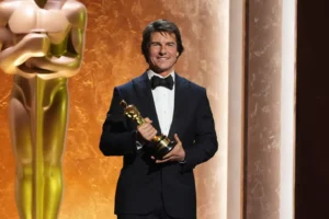 Tom Cruise, winner of an Academy honorary award poses onstage during the 16th Governors Awards on Sunday, Nov. 16, 2025, at The Ray Dolby Ballroom in Los Angeles. (AP Photo/Chris Pizzello)