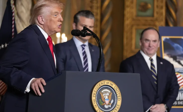 President Donald Trump speaks, with from left, Defense Secretary Pete Hegseth and Secretary of the Navy John Phelan,at his Mar-a-Lago club, Monday, Dec. 22, 2025, in Palm Beach, Fla. (AP Photo/Alex Brandon) golden fleet