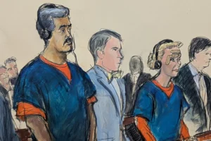 In this courtroom sketch, Venezuelan President Nicolas Maduro, left, and his wife, Cilia Flores, second from right, appear in Manhattan federal court with their defense attorneys Mark Donnelly, second from left, and Andres Sanchez, Monday, Jan. 5, 2026, in New York. (Elizabeth Williams via AP)