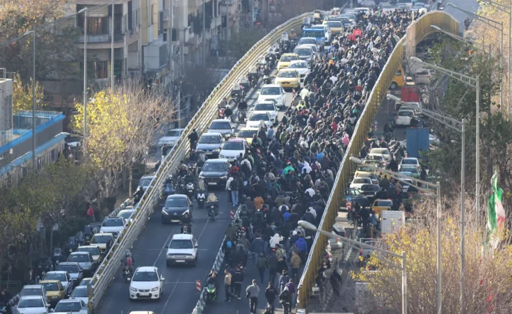 Protesters march in downtown Tehran, Iran, Monday, Dec. 29, 2025. (Fars News Agency via AP)
