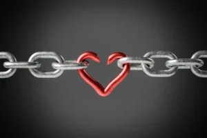 Broken chain shaped as a heart on gray background. By AntonioSolano/stock.adobe.com. Philip Yancey